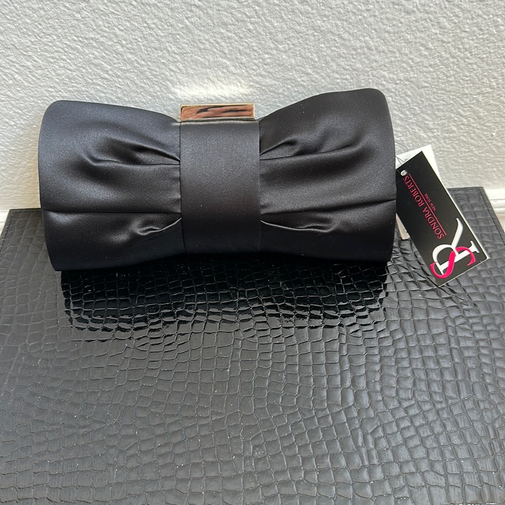 Brand new Sondra Roberts satin clutch.